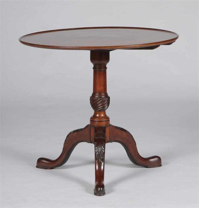 Appraisal: GEORGE III CARVED MAHOGANY TRIPOD TABLE The dished tilt top