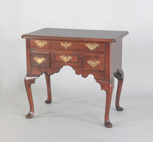 Appraisal: Pennsylvania Queen Anne carved walnut dressing table ca the rectangular