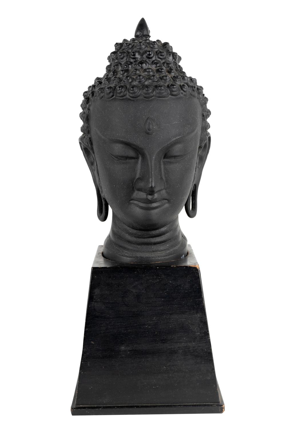 Appraisal: BLACK-PAINTED METAL BUDDHISTIC HEADon a wooden plinth Condition head not