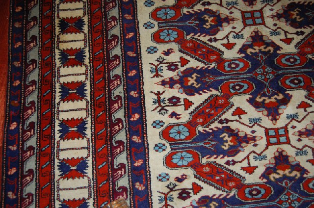 Appraisal: A WOVEN FLORAL AND TREE GROUND PERSIAN RUG x cm