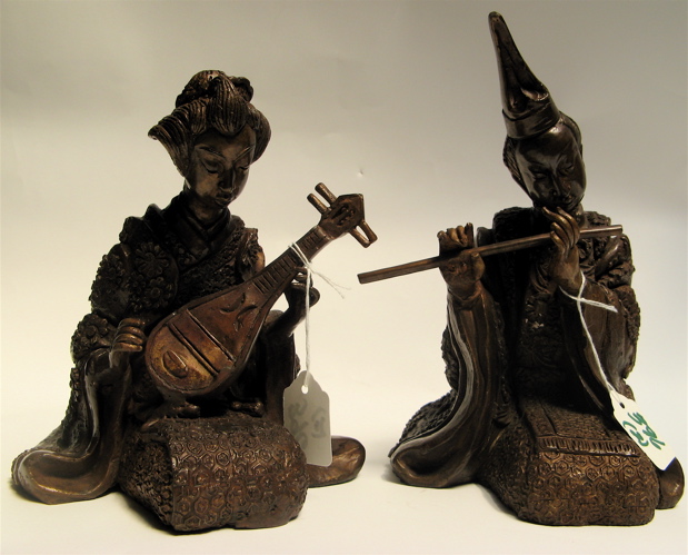 Appraisal: TWO BRONZE SEATED MUSICIANS woman playing a stringed instrument and