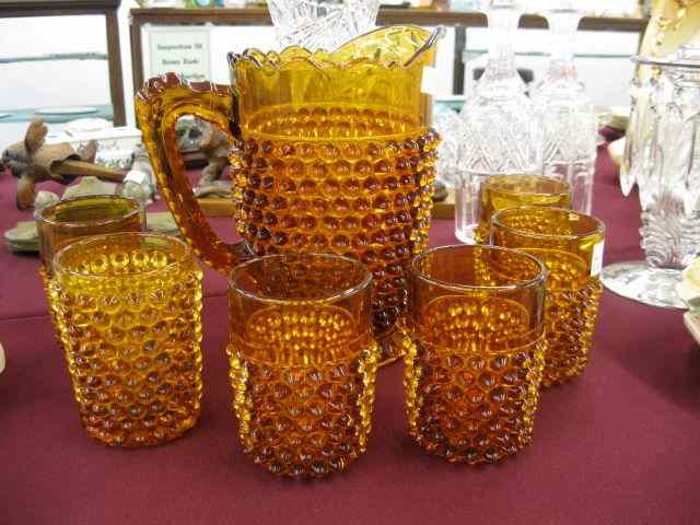 Appraisal: Amber Art Glass Water Set pitcher and six tumblers pitcher