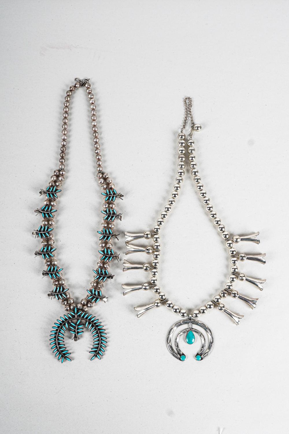 Appraisal: TWO SILVER TURQUOISE SQUASH BLOSSOM NECKLACESeach necklace containing pear and