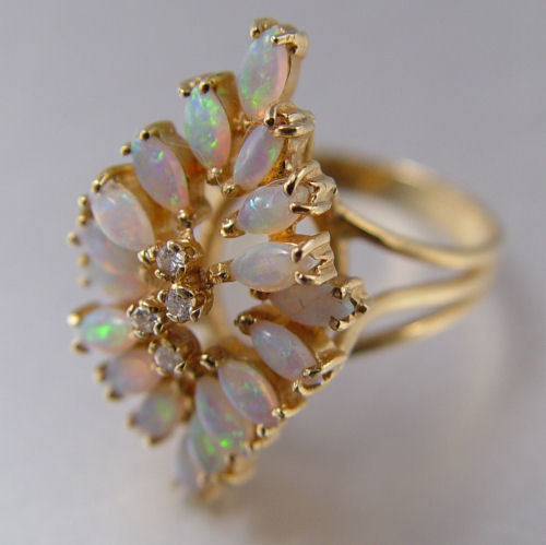 Appraisal: K SEMI-CRYSTAL OPAL DIAMOND RING K yellow gold ring contains