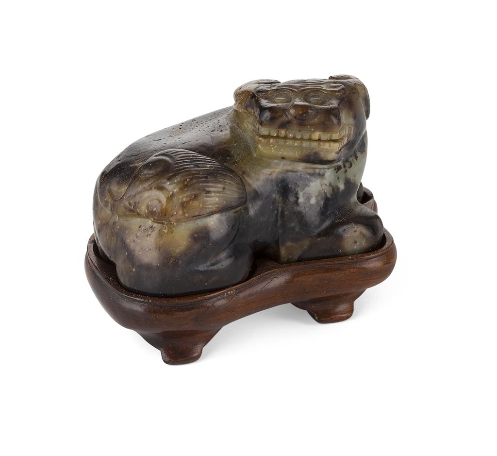 Appraisal: THREE JADE CARVINGS OF MYTHICAL BEASTS comprising one modelled as