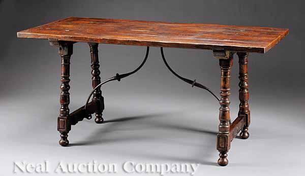 Appraisal: A Renaissance-Style Carved Walnut Table the turned legs joined by