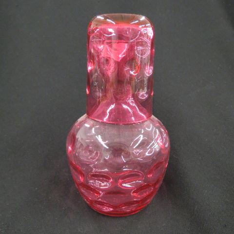 Appraisal: Cranberry Art Glass Bedside Carafe Mug thumbprint decor excellent