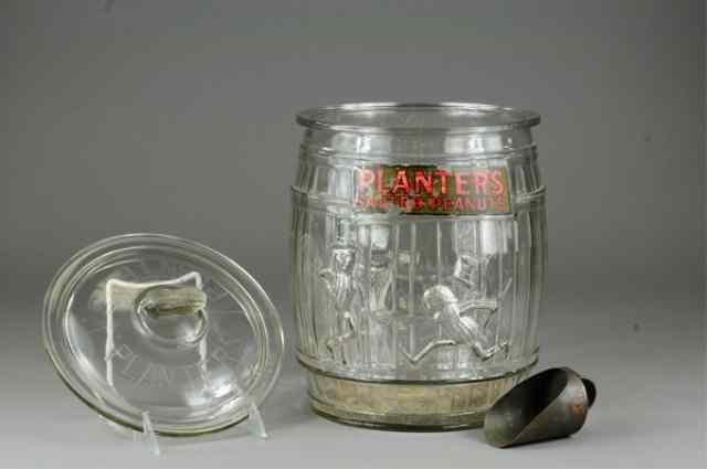 Appraisal: PLANTERS PEANUT JAR Glass peanut jar has embossed figures with