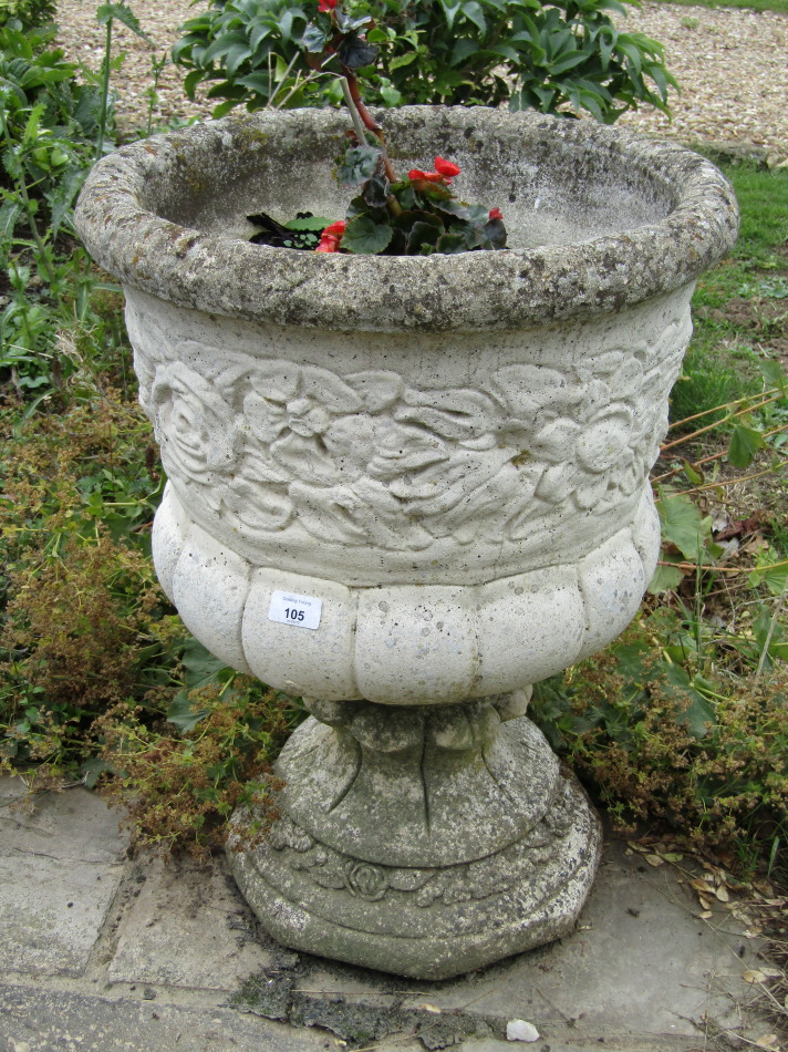 Appraisal: A pair of modern stone garden urns cm high and