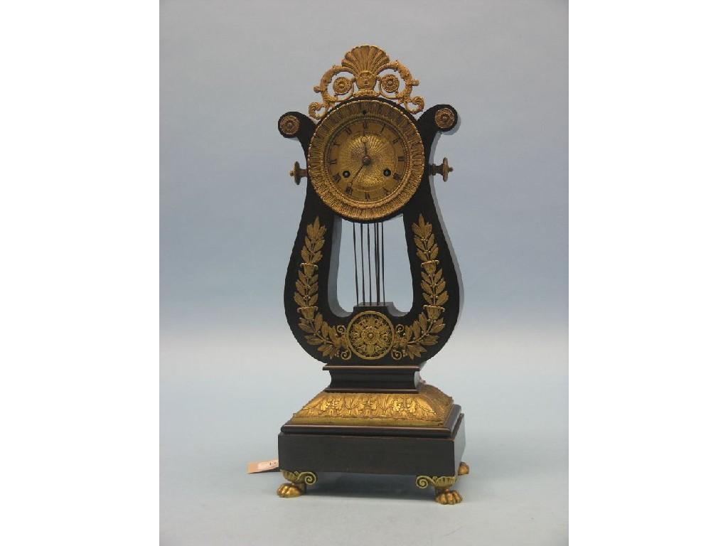 Appraisal: A th century French ebonised and gilt metal mantel clock