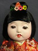 Appraisal: JAPANESE DOLL WITH PILLOW Excellent condition composition glass eyes jointed