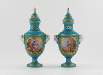 Appraisal: A pair of S vres-style vases and covers each painted