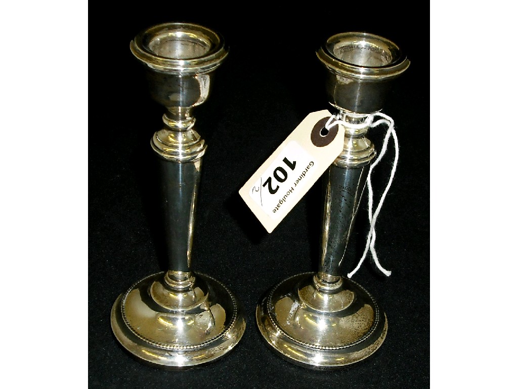 Appraisal: Pair of modern candlesticks of plain turned form high maker