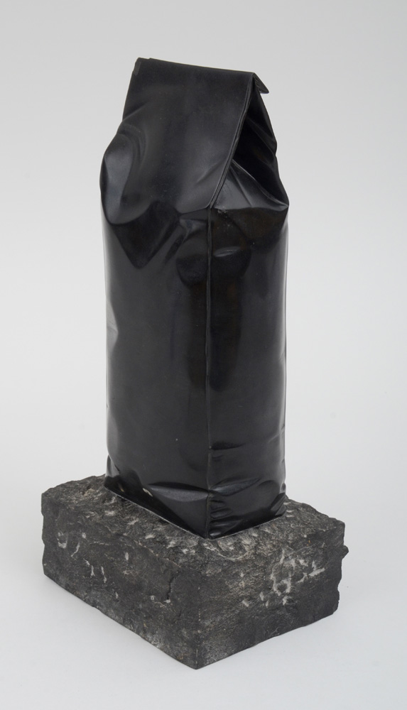 Appraisal: JOAN MORA b COFFEE BEANS BAG Polished black slate with