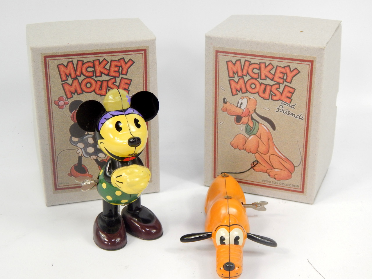 Appraisal: Two retro toy collection tin plate toys comprising Minnie Mouse