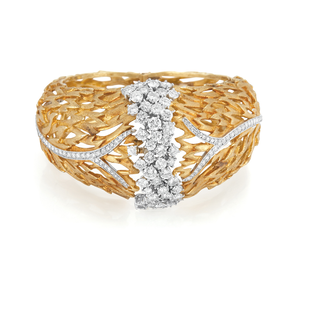 Appraisal: Gold Platinum and Diamond Bangle Bracelet The domed pierced textured