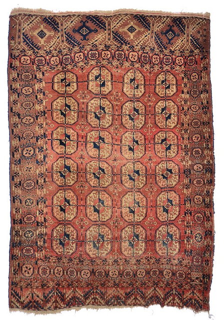 Appraisal: AN OLD TEKKE TURKOMAN BRICK RED GROUND RUG with four