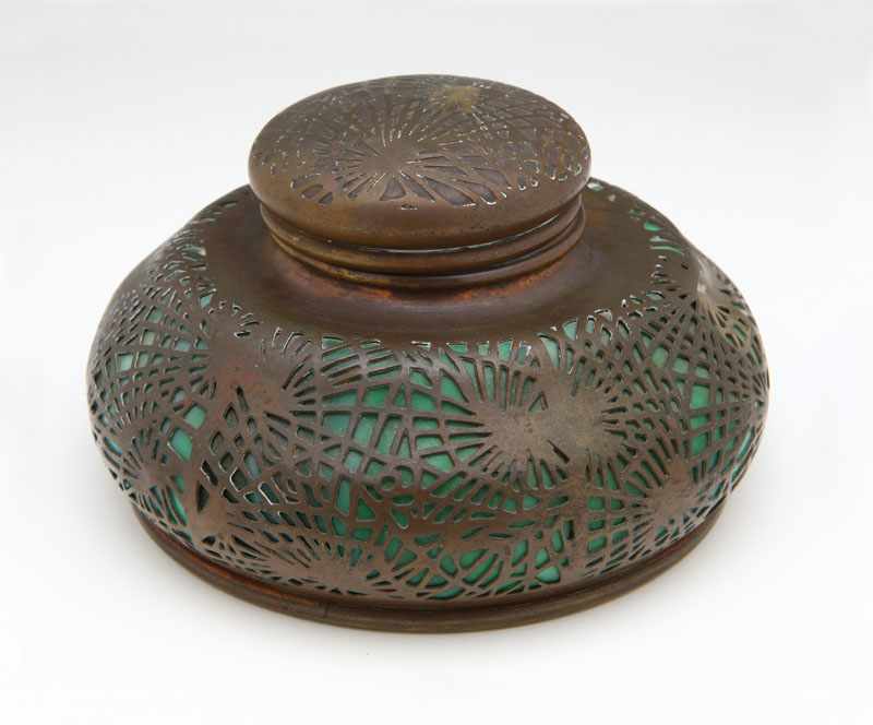 Appraisal: A Tiffany Studios patinated bronze and glass 'Pine Needles' inkwell