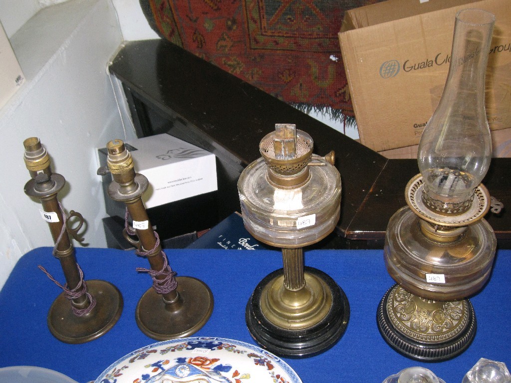 Appraisal: Lot comprising a pair of brass lamps and two oil