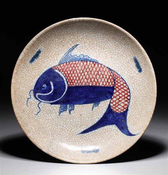 Appraisal: Chinese blue and red crackle glazed dish with fish design