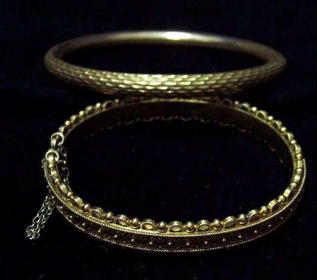 Appraisal: A child's bangle with studded decoration and another bangle