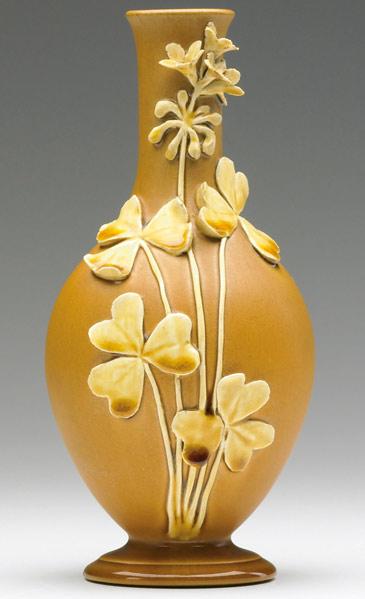 Appraisal: CHELSEA KERAMIC ART WORKS Bottle-shaped vase applied with clover leaves