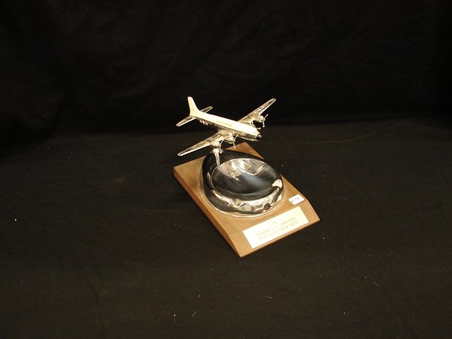 Appraisal: Presentation ashtray with mounted aircraft metal model from Douglas with