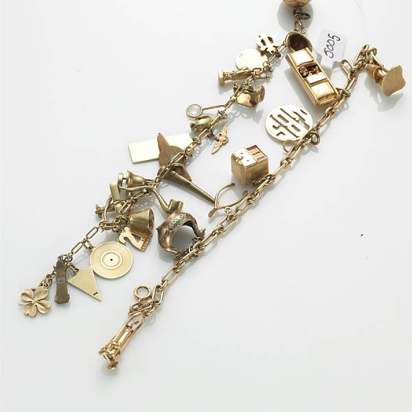 Appraisal: Two k gold and silver charm bracelets suspending twenty-eight charms