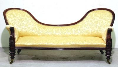 Appraisal: A VICTORIAN WALNUT DOUBLE ENDED SOFA upholstered in yellow foliate