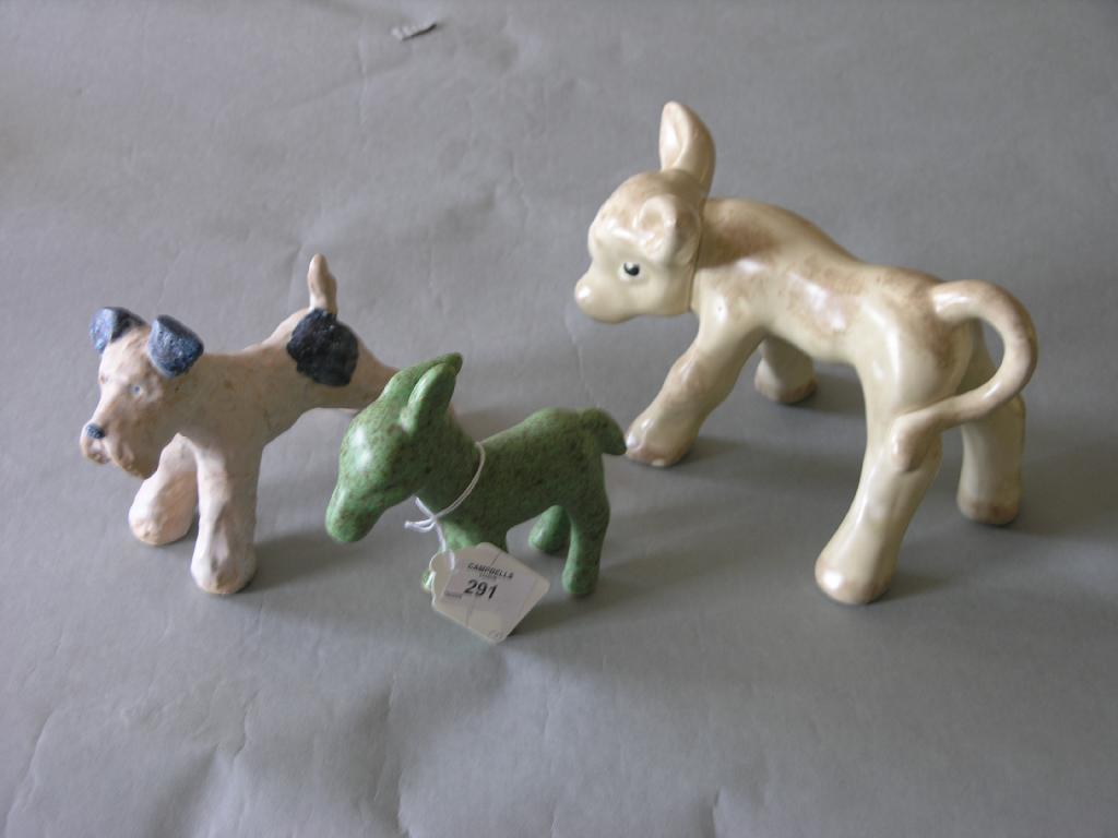 Appraisal: A Bourne Denby dog model in together with a cream