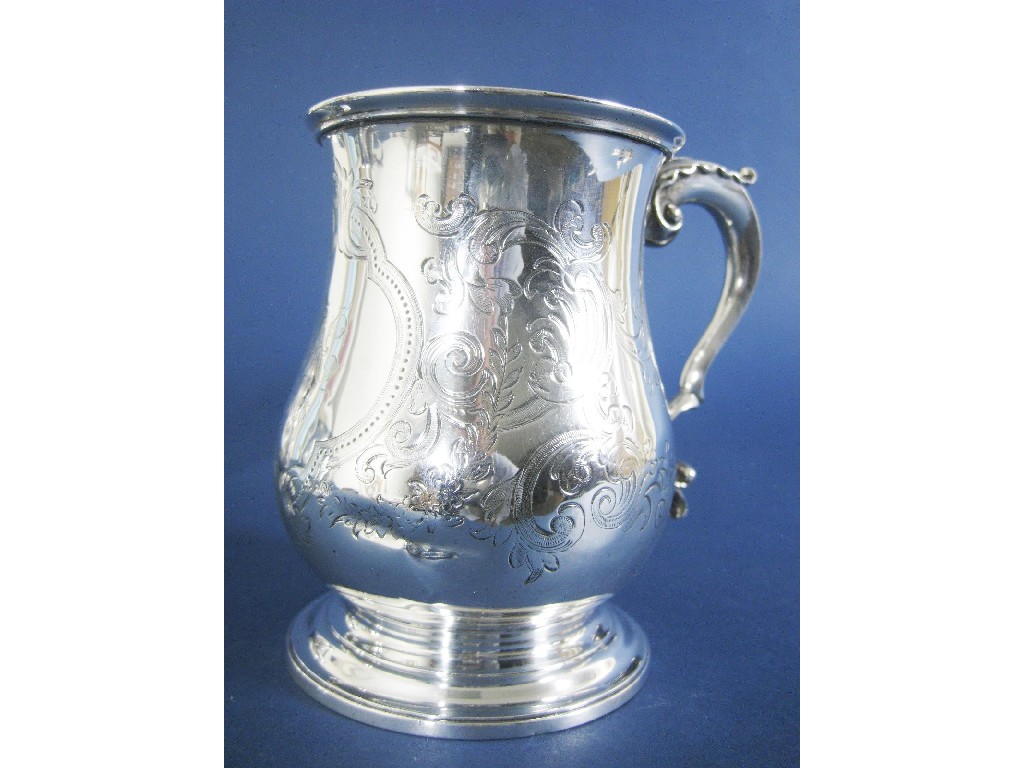 Appraisal: A Victorian baluster Pint Mug with leafage scroll engraving shaped