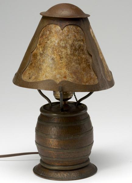 Appraisal: ARTS CRAFTS LIGHTING Hammered copper table lamp its barrel-shaped base