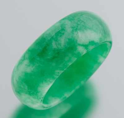 Appraisal: A Carved Jade Ring Well carved and smoothly polished ring