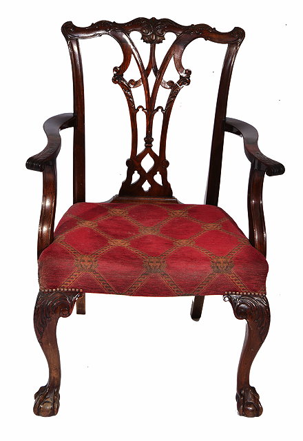 Appraisal: AN ANTIQUE CHIPPENDALE STYLE MAHOGANY CARVER ARMCHAIR with carved cresting