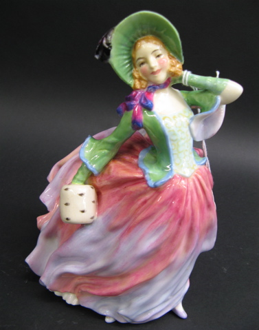 Appraisal: A ROYAL DOULTON PORCELAIN FIGURINE Autumn Breezes HN having red