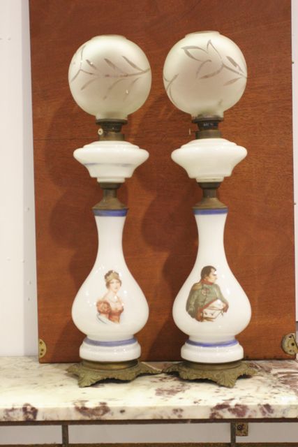 Appraisal: A pair of milk glass oil lamps printed with portraits