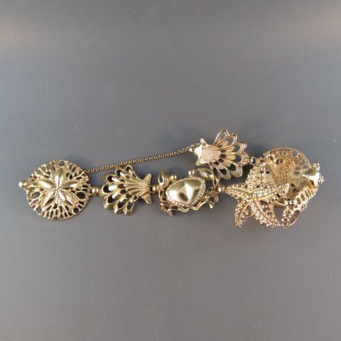 Appraisal: k Gold Beach Bracelet shells sand dollar seahorse and crab