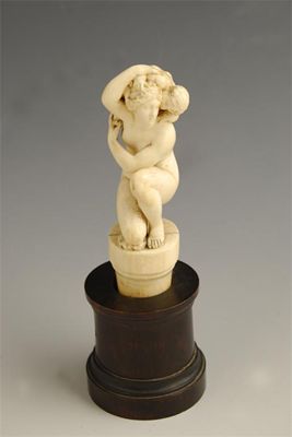 Appraisal: A French carved ivory group of The Crouching Venus with