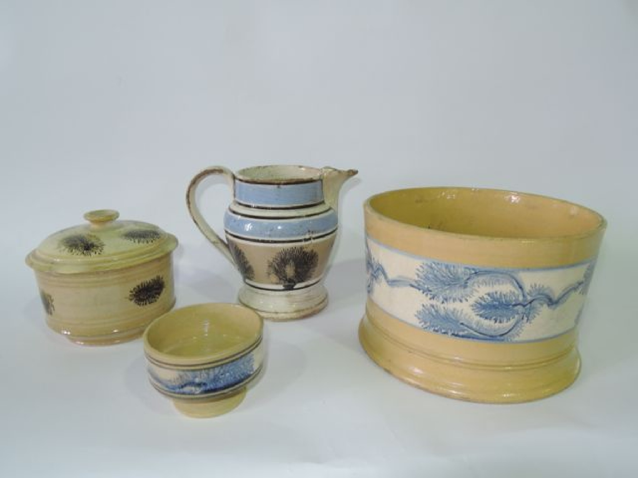 Appraisal: A collection of th century mocha wares comprising a yellow