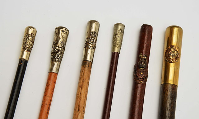 Appraisal: A GROUP OF SIX REGIMENTAL SWAGGER STICKS all bearing crests