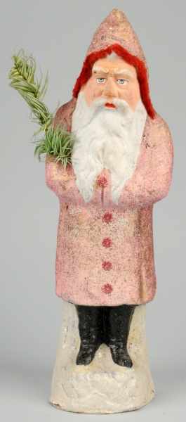 Appraisal: Christmas Santa Frowning Face Belsnickle Description Pink coat Holding fir