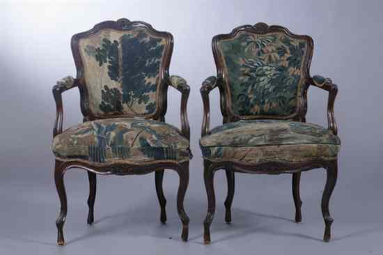 Appraisal: PAIR ITALIAN LOUIS XV CARVED WALNUT ARMCHAIRS th century probably