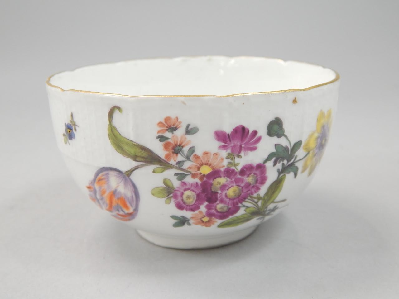 Appraisal: A small Meissen bowl painted with flowers within a stylised