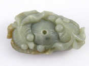 Appraisal: A Chinese jade pendant carved with two carp around a