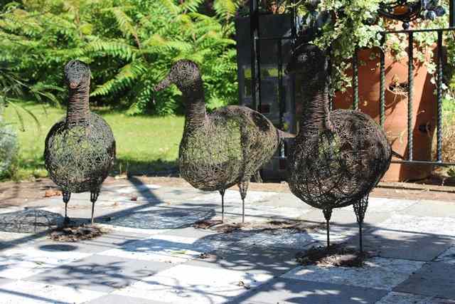 Appraisal: A SET OF THREE WIRE WORK SCULPTURES OF GEESE the