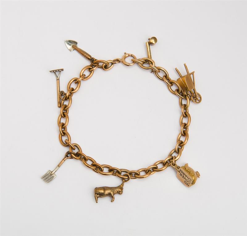 Appraisal: K YELLOW GOLD CHARM BRACELET Depicting garden implements and farm