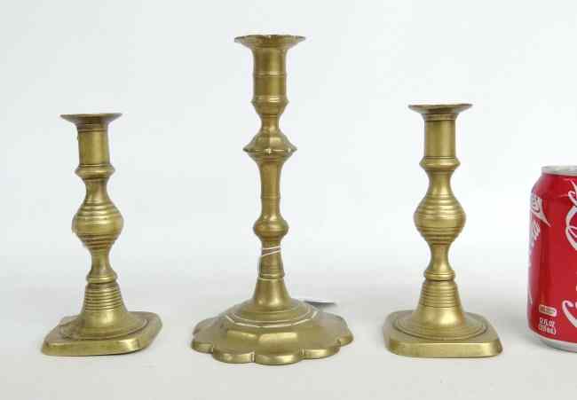 Appraisal: Lot three th th c brass candlesticks including '' Ht