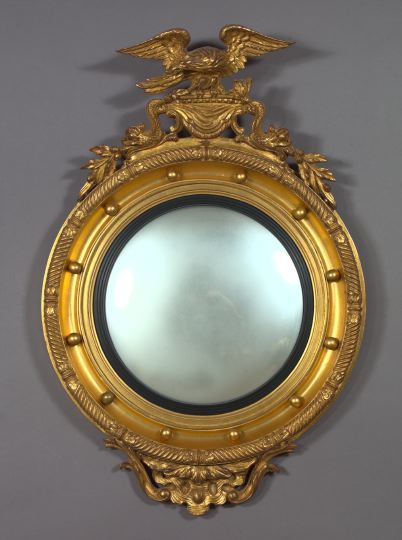 Appraisal: English Carved Parcel-Ebonized and Gilded Convex or Bull's-Eye Looking Glass