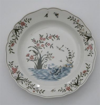 Appraisal: A Meissen plate painted with a fish leaping to catch