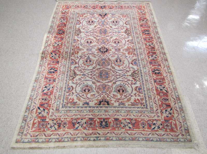 Appraisal: HAND KNOTTED ORIENTAL AREA RUG Pakistani-Persian overall floral design on